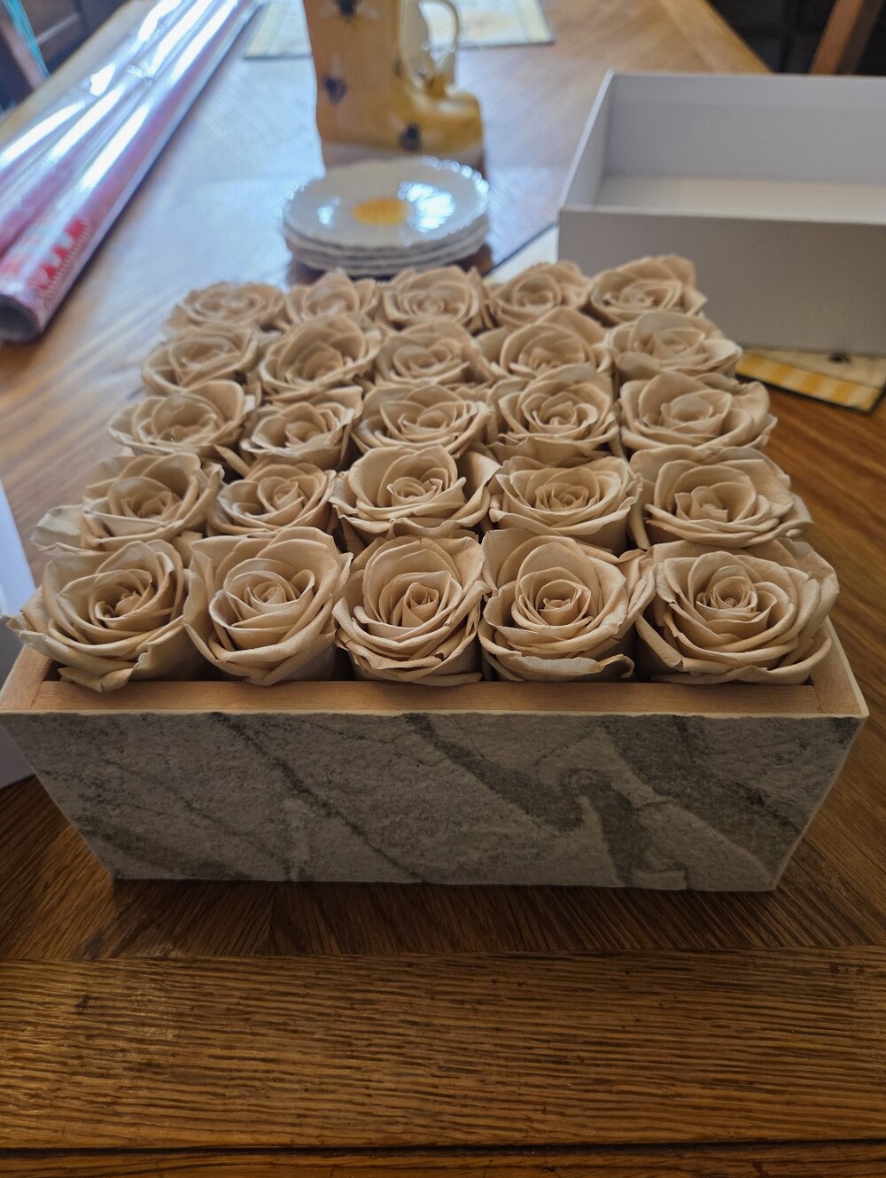 Preserved real roses.This specific arrangement showcases a matrix of their signa